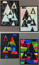 Load image into Gallery viewer, Four geometric art pieces with triangles on a gray background