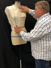Load image into Gallery viewer, Man adjusting a dress form against a black background