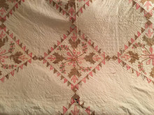 Load image into Gallery viewer, Quilt with a diamond pattern in brown and pink on a beige background
