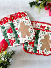 Load image into Gallery viewer, Hot pads stitched with holiday design
