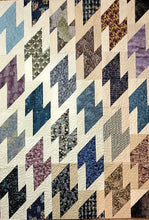 Load image into Gallery viewer, Quilt with geometric pattern in various colors
