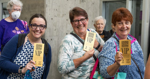 Women holding VIP tickets