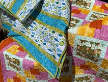 Load image into Gallery viewer, Colorful patchwork quilts with various patterns and colors.
