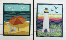 Load image into Gallery viewer, Two quilted wall hangings depicting a beach scene with an umbrella and a lighthouse.
