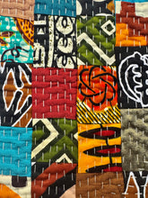 Load image into Gallery viewer, Colorful patchwork fabric with geometric patterns in various colors.
