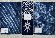 Load image into Gallery viewer, Textured blue fabric samples with labels on a checkered background
